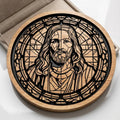 Wooden circular plaque with laser-cut design of a face, placed on a white surface.
